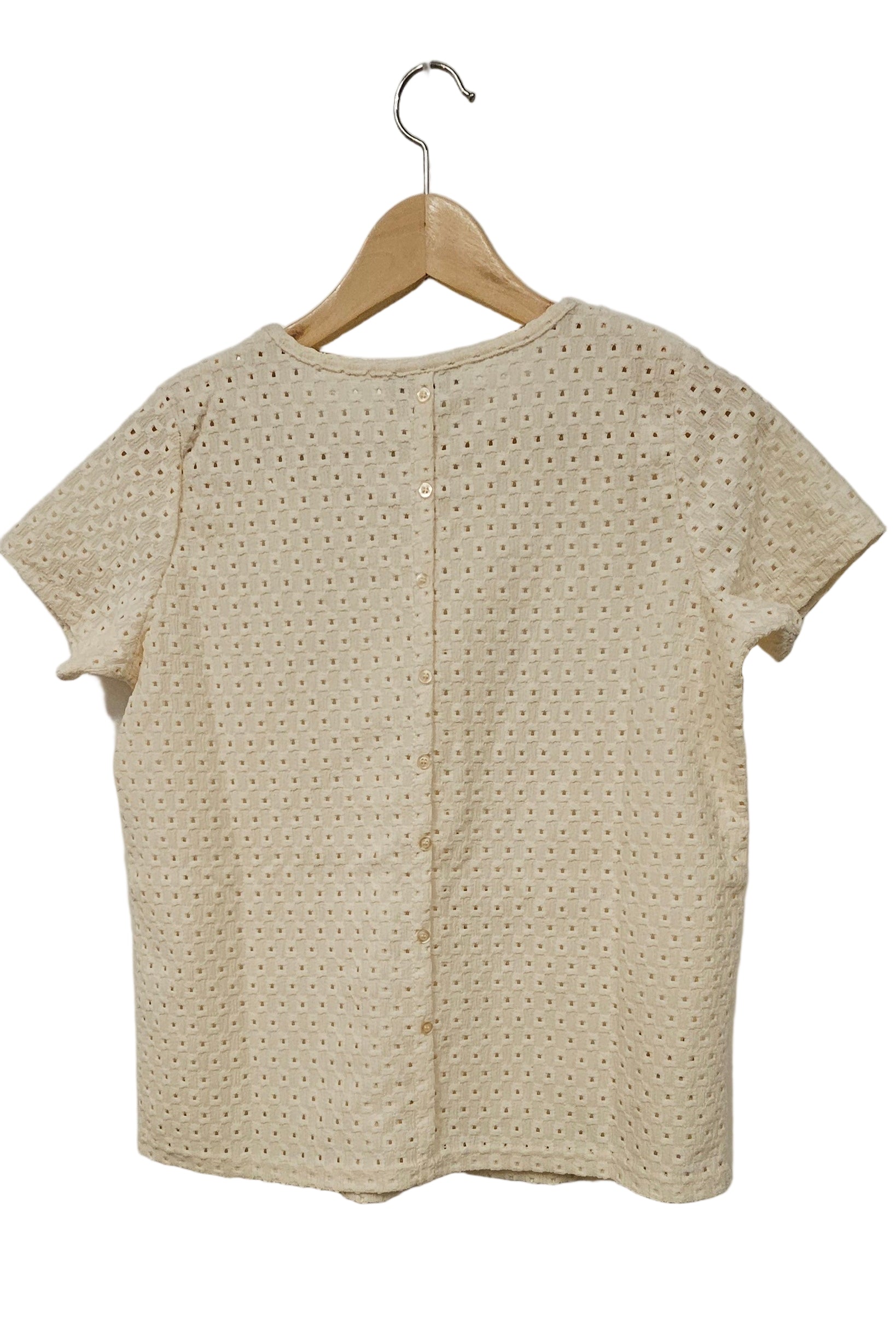 Blus med knappar bak